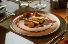 A diverse buffet spread showcasing a variety of food options, elegantly presented on wooden trays.